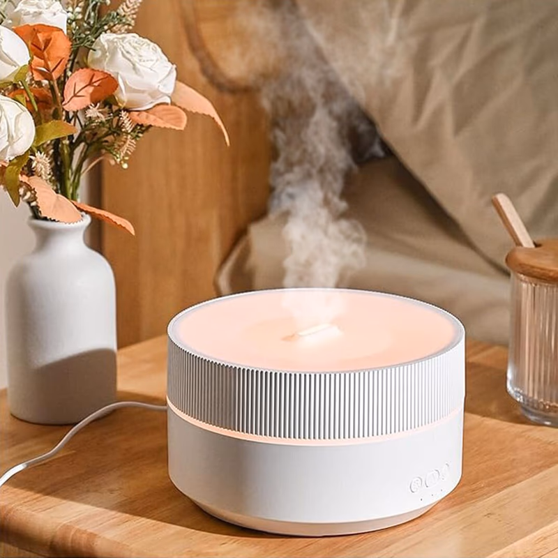 clairu humidifier emitting mist on a nightstand