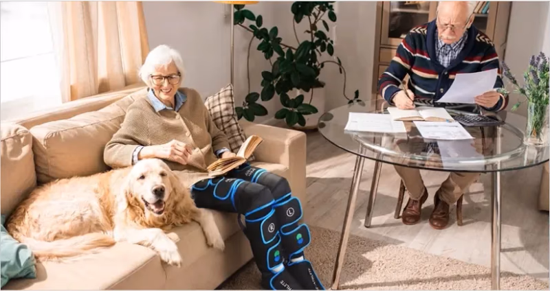 elderly couple with air c compression massager on legs