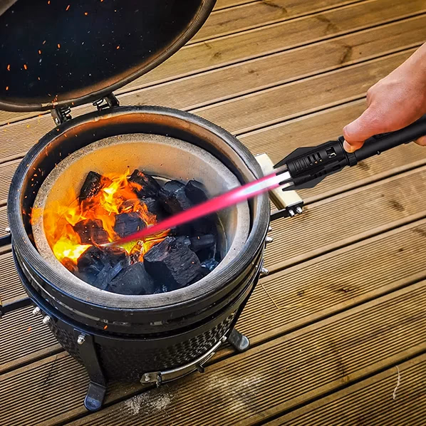 electrablaze torch igniting coals in a grill