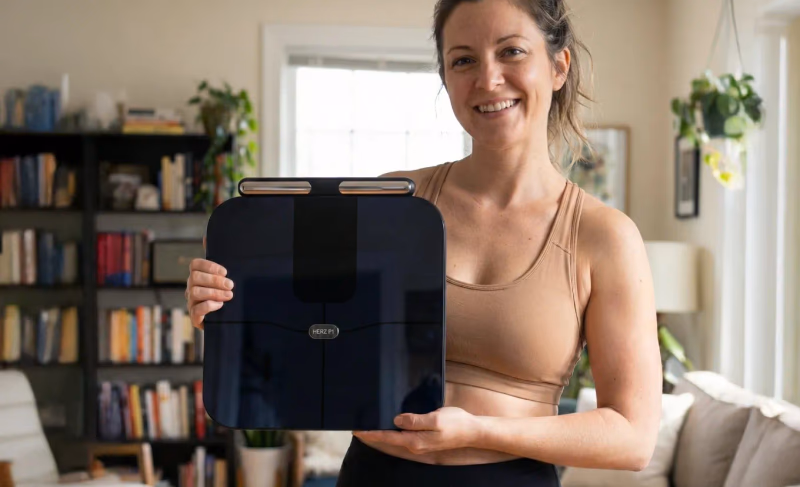 herz p1 smart scale held by woman