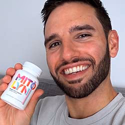 man holding mitolyn weight loss supplement bottle
