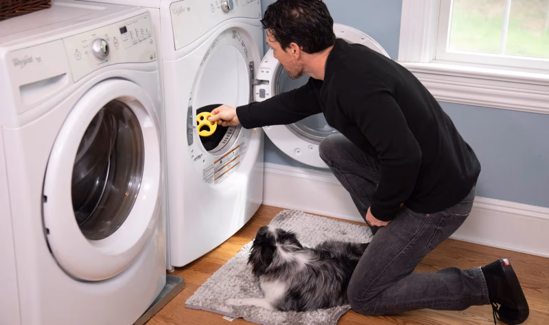 man putting furzapper in dryer