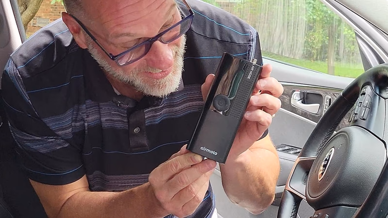 man showing portable air pump