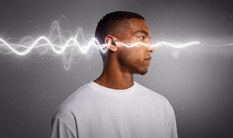 man wearing hears earplugs with sound waves