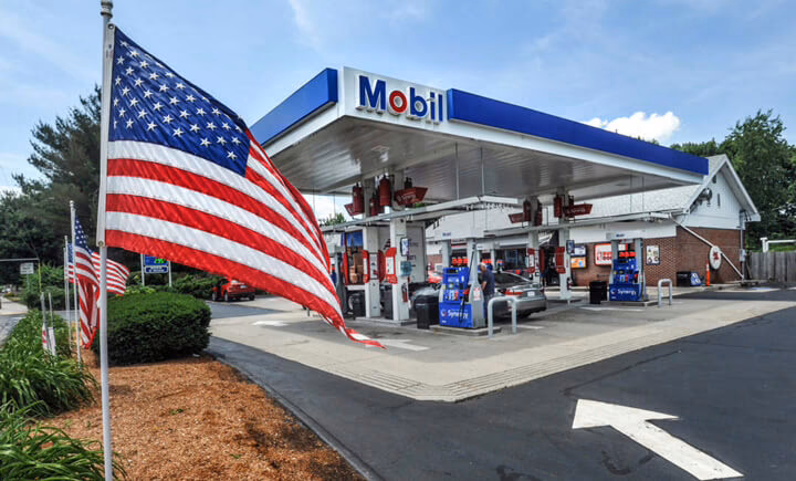 mobil gas station with american flag in foreground