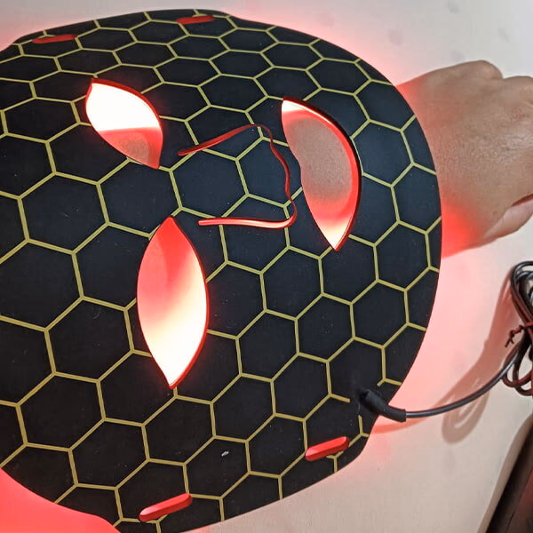 nuroderma red light therapy mask on arm