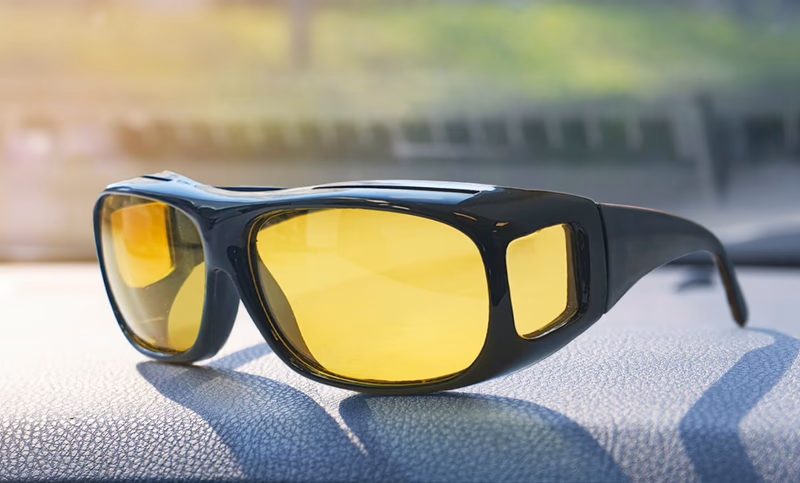 polorvision glasses on a car dashboard