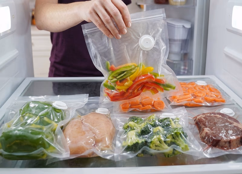 sealpro vacuum sealer bag filled with colorful bell peppers