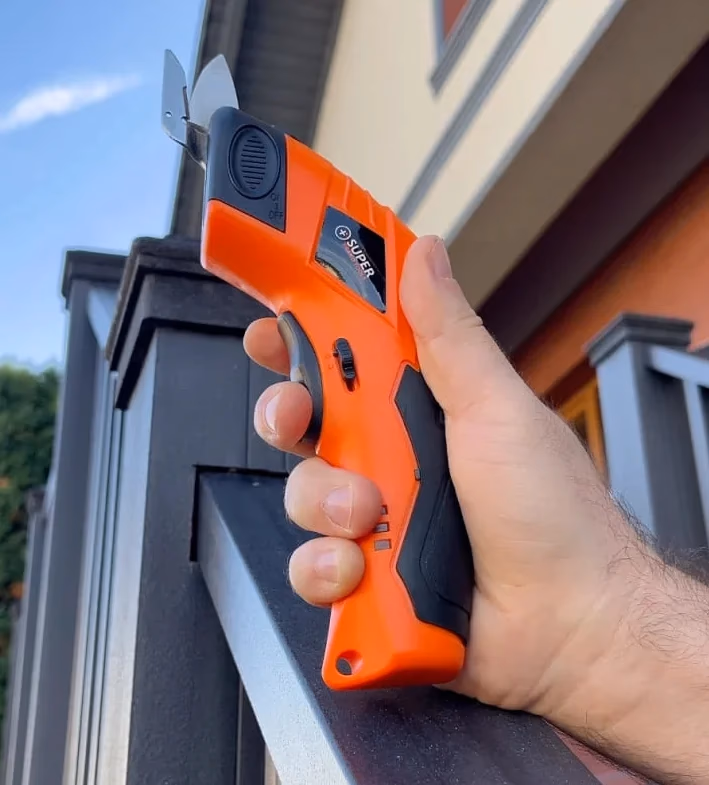 superscissor being held in hand