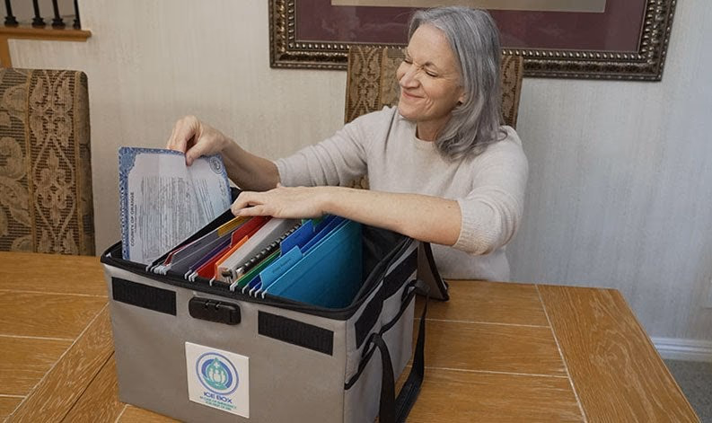 woman organizing documents in ice box