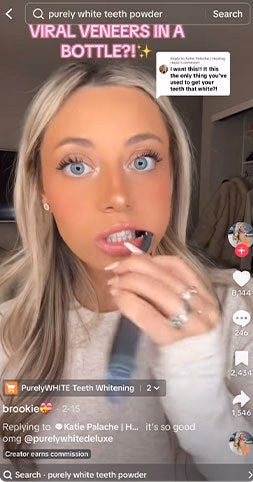 woman using purely white teeth powder for whitening