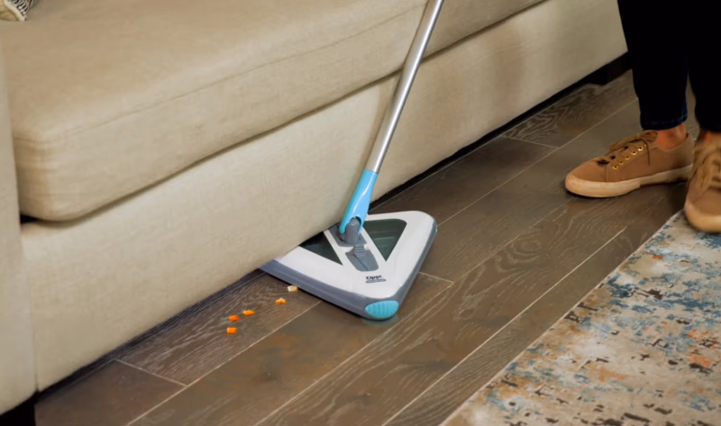 zippi sweeper cleaning under a couch
